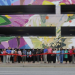 Dunwoody Officials, Perimeter area leaders and MARTA representatives cut the ribbon on a new mural by artist DAAS at the Dunwoody MARTA Station June 1. ALEX POPP/APPEN MEDIA